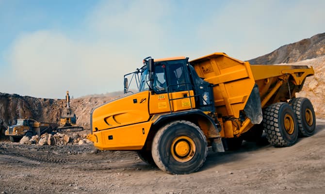 Large yellow mining truck in an open-pit mine