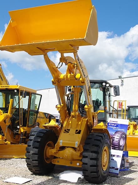 Close-up of yellow construction loader or excavator with large bucket